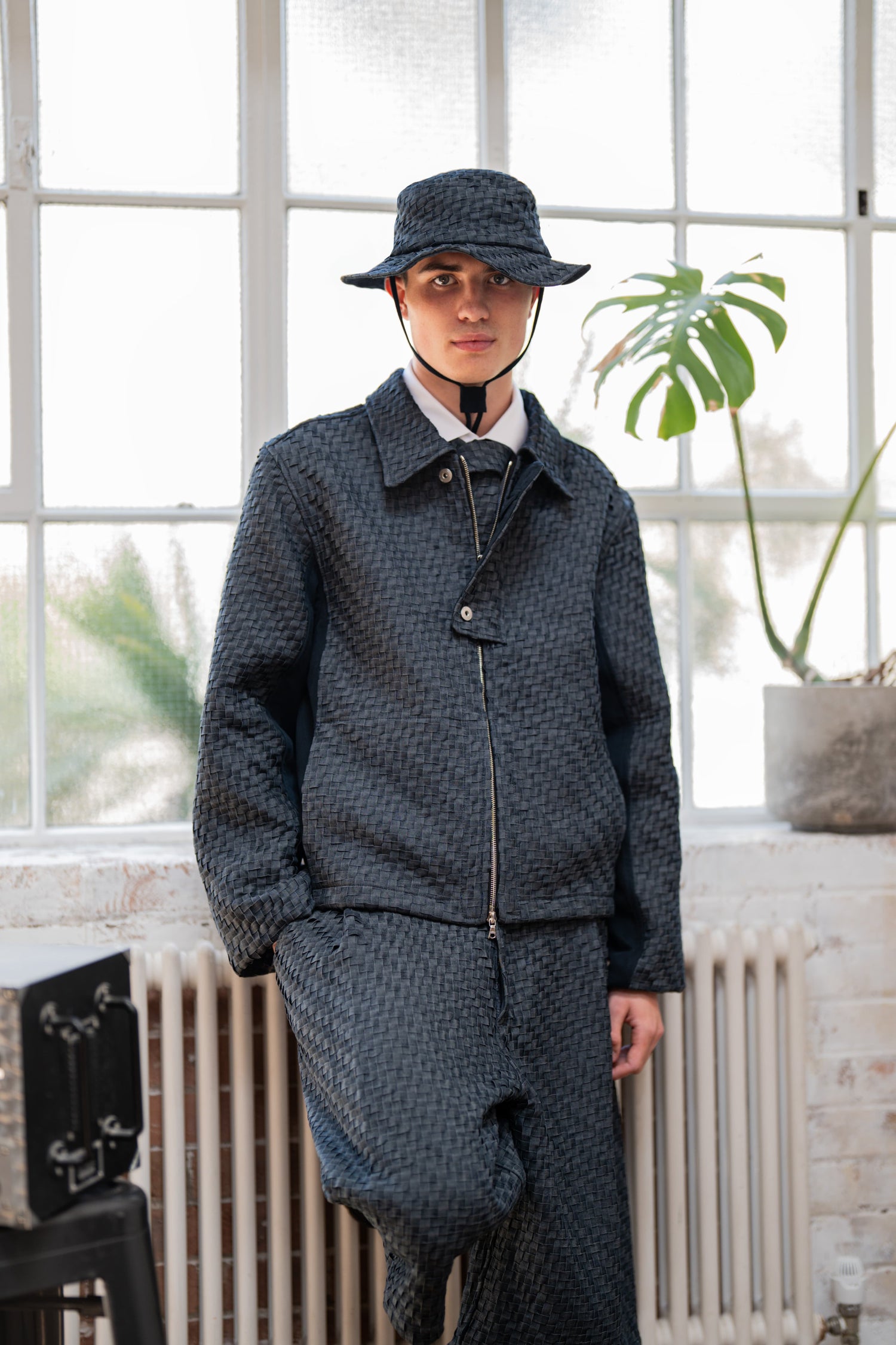 Model wears woven denim set in blue