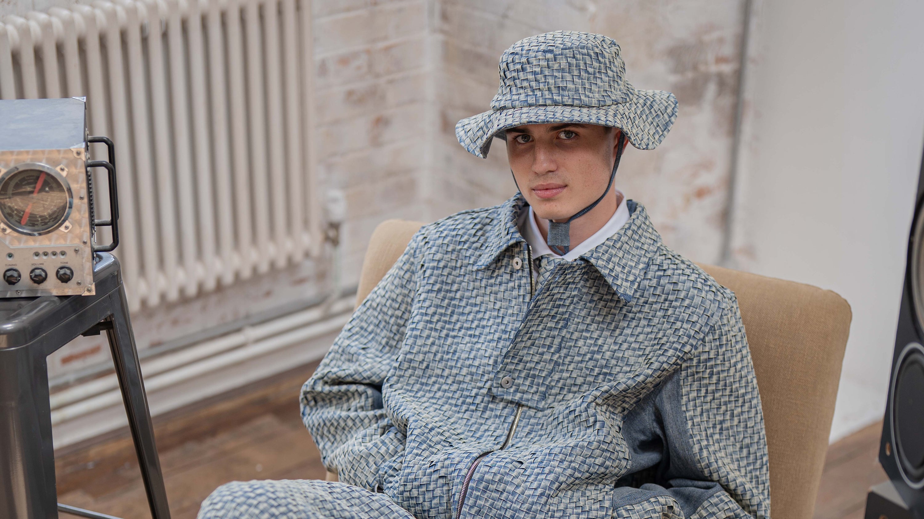 Model wears woven denim set in sand wash 