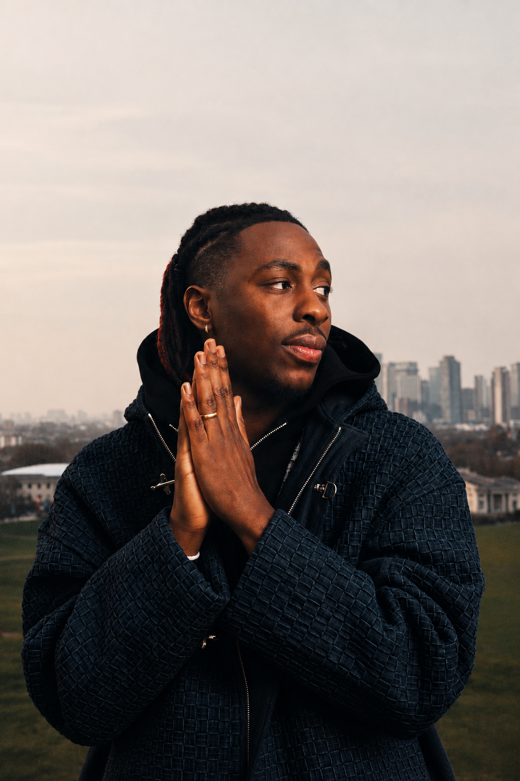 Eberechi Eze wears BRYDER woven denim jacket in fashion shoot in London.