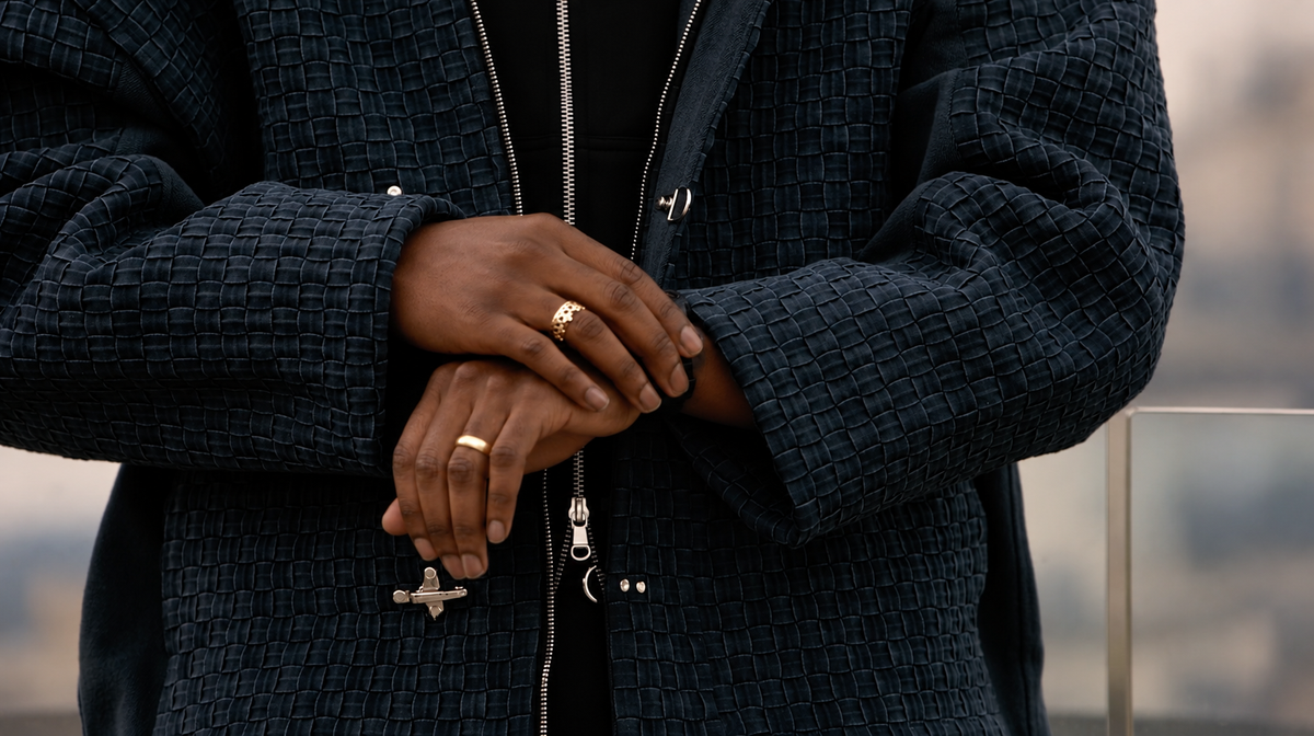 Eberechi Eze wears BRYDER woven denim jacket in fashion shoot in London. Close up